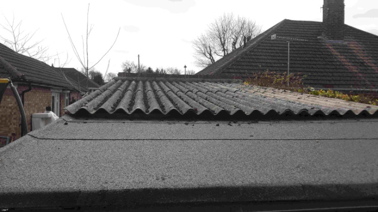 K.W.S. leaking old garage roof perished felt corrugate roofing sheets
