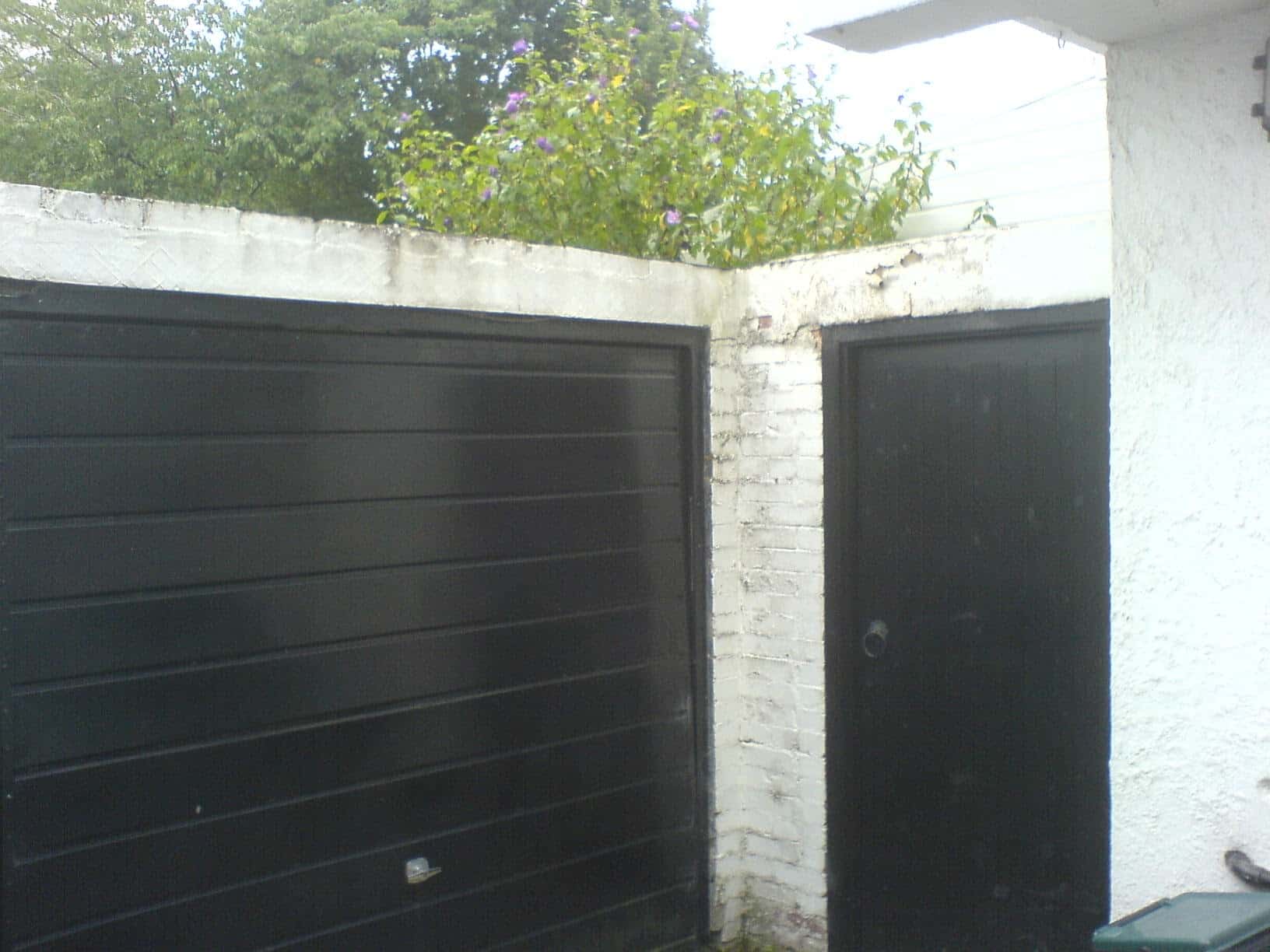 K.W.S. petts wood garage wall before renovations blown brickface water damage flaky paint